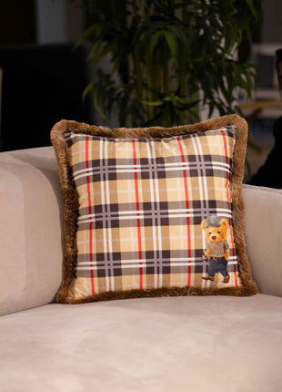 Checked decorative pillow with a teddy bear motif