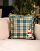 Checked decorative pillow with a teddy bear motif