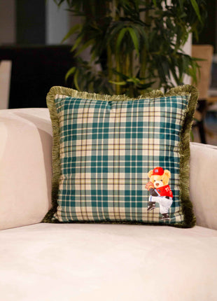 Checked decorative pillow with a teddy bear motif