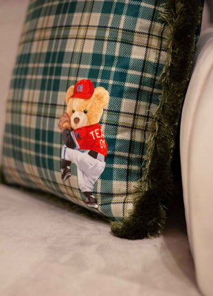Checked decorative pillow with a teddy bear motif