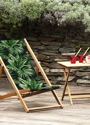 Black deck chair with tropical leaves