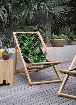 Black deck chair with tropical leaves