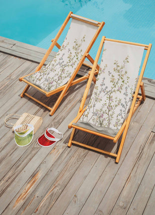 Deckchair with beige fabric and a plant motif